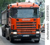 Small photo of RIGA - SEP 8: Scania 114G V8 530 truck on a road on Sep. 8, 2014 in Riga, Latvia. Scania is a major Swedish automotive manufacturer of commercial vehicles - specifically heavy trucks and buses.