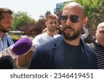 Small photo of Bucharest, Romania. 17th July, 2023: Andrew Tate (R) and his brother Tristan Tate (L) leave the Bucharest Court