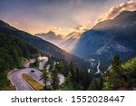 Aerial view of Maloja Pass road in Switzerland at sunset. This Swiss Alps mountain road is located in dense forests of the canton Graubunden. Hdr processed.