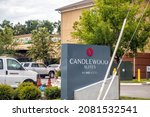 Small photo of Jacksonville, USA - July 6, 2021: Sign on building exterior entrance of Candlewood Suites IHG hotel in Jacksonville beach Mayport area for extended stays including kitchen rooms