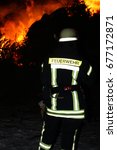 Small photo of A northern german holyday called "Biikebrennen" or "Osterfeuer". For security are always firefighter "Feuerwehr" at the place of the event.