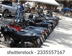 Small photo of cruz das alma, bahia, brazil - july 17, 2023: Parking of motorcycles in a square in the city of Cruz das Almas.