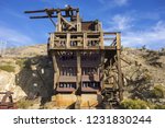 stock-photo-lost-horse-gold-and-silver-mine-platform-and-rust-colored-industrial-machine-equipment-in-joshua-1231830244.jpg