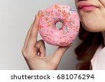 Woman with donut closeup sweetness delicious sweet tooth                               