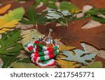 Small photo of Incandescent lamp. Composition with autumn leaves and incandescent lamp.