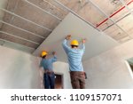 Two man help for ceiling house construction