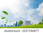 Small photo of wind turbine farm and green leaf blowin in smart city.renewable energy.sustainable and environmentally friendly.