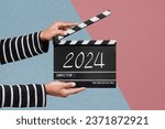Small photo of Film crew holding a clapperboard or film slate For filming the new story in year 2024.
