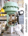 Small photo of Pressure control valve in oil and gas process and controlled by Program Logic Control, PLC controller the valve and control instrument gas supply to actuator of the valve as PLC command.