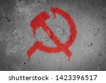 Small photo of Hammer and sickle,Communism symbol spray painted on the wall