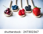 Berries On Wooden Background