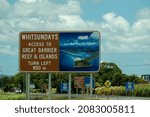 Small photo of Proserpine, Queensland, Australia - November 2021: Outdoor billboard advertising directions to Whitsundays