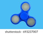 Small photo of blue isolated spinn toy