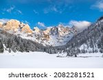 Dolomiti winter landscape, snow and peaks of Pale di San Martino into Trentino natural park. Snow trekking and winter landscape from italian alps