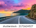 highway landscape at colorful sunset. Road view on the sea. colorful seascape with beautiful road. highway view on ocean beach. coastal road in europe. Colorful seascape in the Mediterranean.