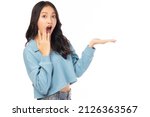 Small photo of Surprised happy beauty asian woman looking camera in excitement Expressive facial expressions Presenting product Beautiful girl act like a telling someone Isolated on white background