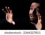 Small photo of Frightened young beard man afraid scared and terrified with fear expression face He shield hands for stop something Guy were shock panic in the horror dark room Emotional and facial expression concept