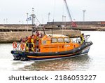 Small photo of LOWESTOFT, SUFFOLK, UK - JULY 30, 2022: Shannon-class lifeboat 13-05 RNLB Patsy Knight, the latest class to serve the shores of the British Isles, sets out during the International Smack Race Festival