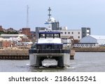 Small photo of LOWESTOFT, SUFFOLK, UK - JULY 30, 2022: Iceni Legend, of Alicat Workboats and part of the Turner Iceni fleet of crew transfer vessels, departs Lowestoft during the International Smack Race Festival.