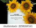 Small photo of Bible verse quote - God First before anything else. Matthew 6:33 But seek first his kingdom and his righteousness, and all these things will be given to you as well. On notebook and sunflowers.