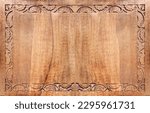 Small photo of Horizontal background with wood carving floral ornament. Decorative carved border on wooden surface. Mock up template. Copy space for text