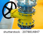 Small photo of Shut-off valve on gas pipe. Fragment of pipeline with valve. Valve on pipe in boiler room. Concept - shutting off gas supply. Flap to shut off gas flow. Yellow steel pipeline close up