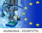 Small photo of Microelectronics production in European Union. PCB making machine. Microelectronics in Europe. Automated soldering machine for microelectronics. PCB manufacture in European Union. EU flag.
