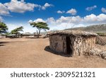 Small photo of Africa. Masai Mara. Reservation in Kenya. The Masai Mara tribe. An old hut made of clay and twigs. The house is made of clay.