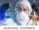 Small photo of Woman biologist. Girl with test tubes. Glass flasks in hands of laboratory assistant. Woman biologist closeup. Biologist works with dangerous samples. Chemical protection mask on girl's face