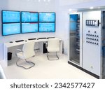 Small photo of Dispatch center of enterprise. Desk for dispatchers. Several monitors above table. Load monitoring center for equipment. Factory dispatch center. Industrial technologies. Control room without people