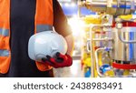 Small photo of Man with hardhat in hand. Industrialist holds protective helmet. Engineer near industrial equipment. Cropped engineer with hardhat. Worker with white helmet. Hardhat for protection against injury