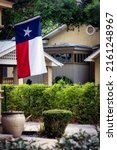 Small photo of A Texas state flag, or Lonestar flag, hangs proudly at the King William Historic District in San Antonio, Texas.