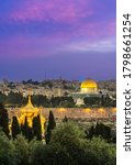 Small photo of Beautiful purple clouds over the Old City Jerusalem, with the Dome of the Rock, the Golden Gate and Russian Orthodox church of Mary Magdalene's golden domes seen through the trees of Mount of Olives