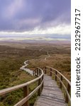 Wooden stairs on a trail through beautiful countryside up a mountain. Cuilcagh Boardwalk Trail in Fermanagh Northern Ireland. Stairway To Heaven