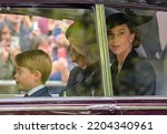 Small photo of London, Westminster, UK, 20th September 2022. Queen Elizabeth II state funeral procession. Catherine Princess of Wales, with Camilla, Queen Consort and Prince George of Wales.