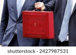 Small photo of London, Downing Street, UK, 15th March 2023. Jeremy Hunt MP Chancellor of the Exchequer holds the red box containing the budget.