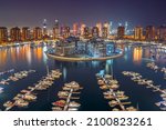 Small photo of Doha, Pearl Qatar - January 01, 2022: Pearl Qatar an artificial island in Qatar. View of the Marina and residential buildings in Porto Arabia in Doha