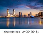 Small photo of Lusail, Qatar - December 26, 2023: Katara buildings view from Lusail Marina Park. Crescent Tower