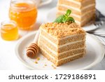 Honey cake Medovik, layer cake on white plate. Closeup view