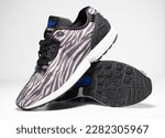 Small photo of kent, uk 01.01.2023 RARE ADIDAS torsion zx FLUX DECON zebra print basketball and sport trainers , stylish retro football street fashion. famous 3 stripes torsion trademark. famous three stripes brand