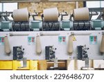 Small photo of industrial stainless steel metal cotton weaving machines , machine weaving cotton for the fashion and textiles industry. Yarn weave traditional textile manufacturing mass production