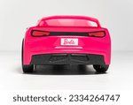 Small photo of Kent, uk, 01.01.2023, A Barbie Glam Convertible Sports Toy radio controlled car. Vehicle isolated white. Modern barbie plastic fantastic pink doll car. Famous doll toys for boys and girls.
