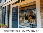 Small photo of London, UK - February 21, 2023: Name sign on the window of London Cheesemongers shop on pavilion Road in Kensington and Chelsea, an affluent area of West London favoured by celebrities.