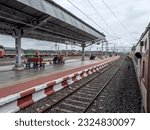 Small photo of Satara, India - June 25 2023: Passenger train hauled by an electric loco at Satara India.