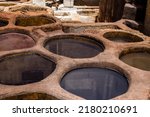 Small photo of Fez, Morocco - June 13, 2022 Chouara Tannery, The dyeing vats at Chouara are among the Fez medina’s most iconic sights. The ancient craft of tanning and dyeing, in all its visceral authenticity