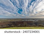 Small photo of A view of Strato Sirrius clouds above Croft Quarry and Huncote Nature reserve in Leicestershire, UK on a bright sunny day