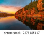 Peaceful forest lake in autumn sunset. Location: Steinbruvann, Oslo, Norway