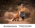 A Little Girl With A Fox In...
