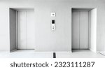 Small photo of Elevators door closed in the hallway condominium. Light grey interior building with metal lifts, residential and commercial service. Architecture structure, elevation concept. Monotone color. Nobody.