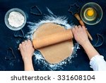 Woman making dough for a Christmas cookies